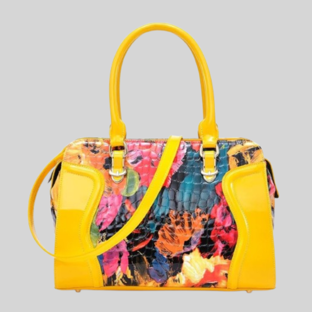 A vibrant, multi-colored patchwork tote bag with high-contrast patterns and its base in yellow, perfect for a bold and eclectic personal style.